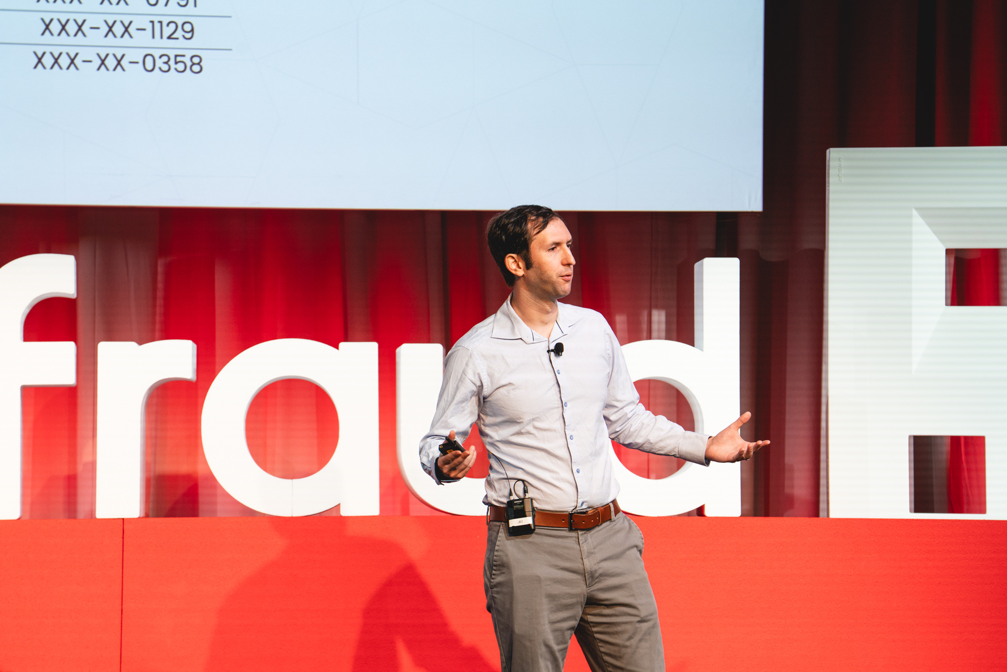 on:fraud speaker on stage